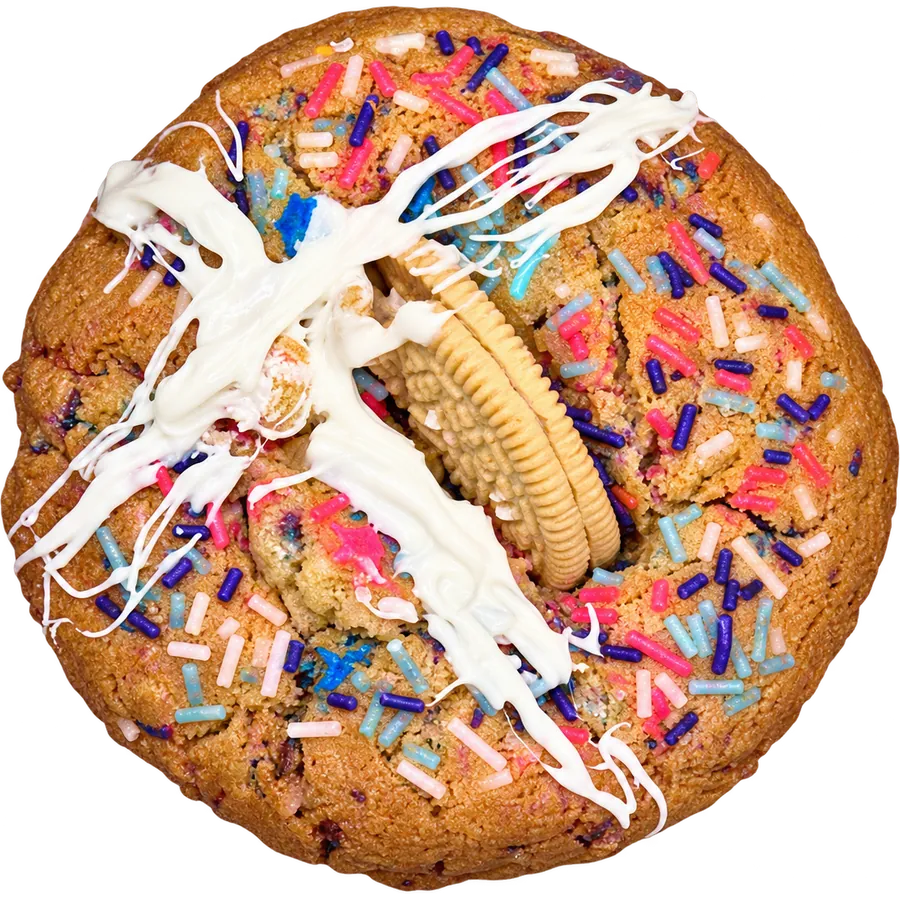 Midnight Carnival cookie with rainbow sprinkles, a vanilla Oreo and white chocolate drizzle
